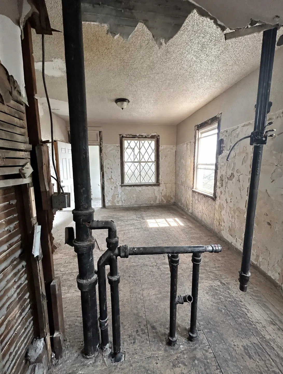 The same interior space cleared of debris after removal