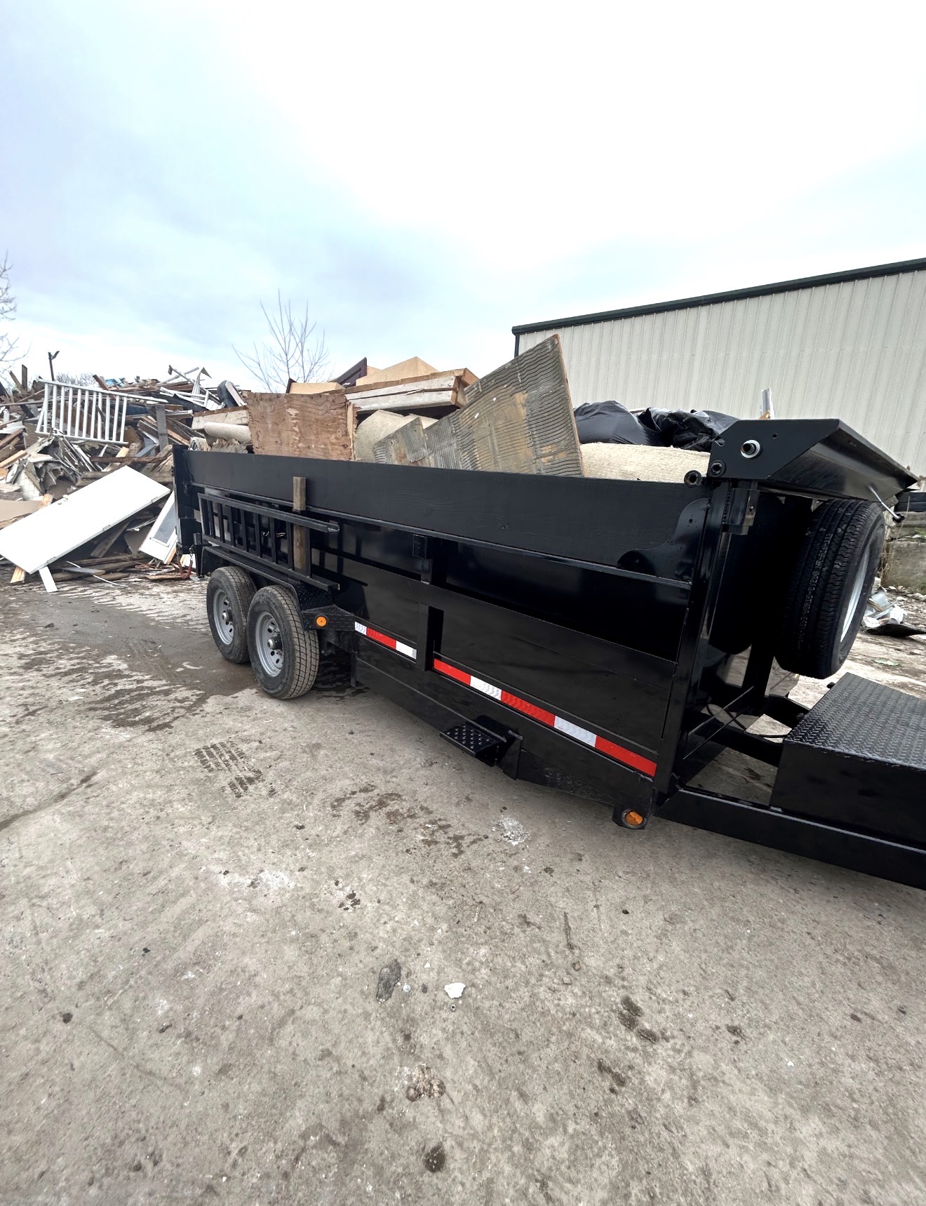 Rigor Contracting trailer loaded with construction debris at the disposal facility