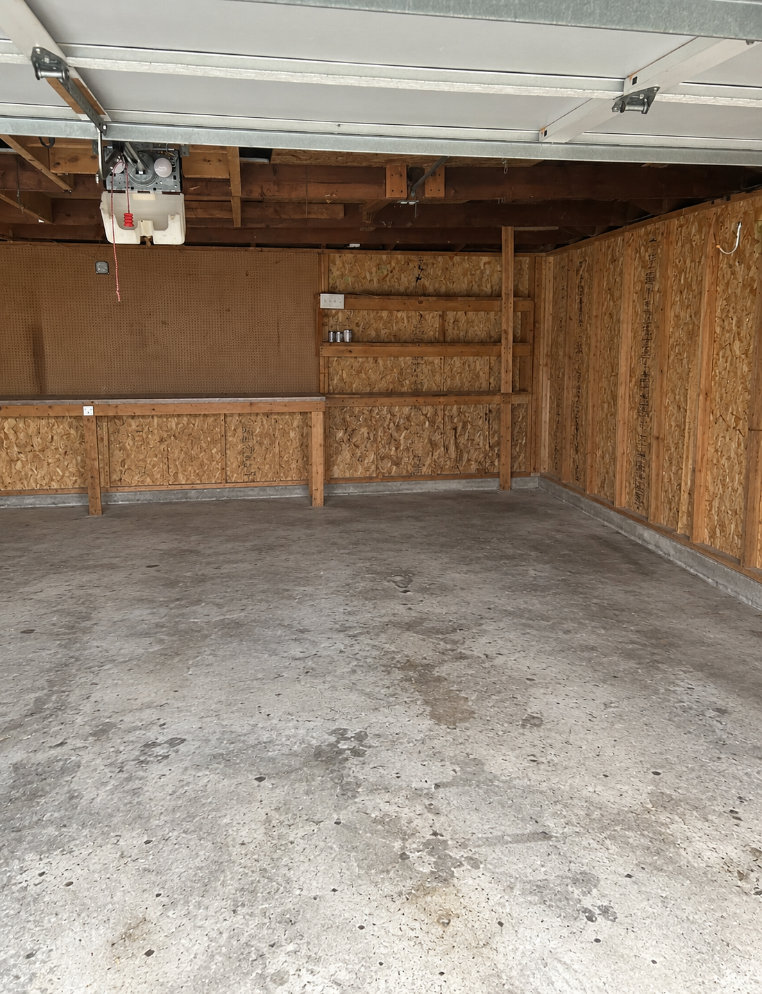 The same garage completely cleared and swept after the cleanout